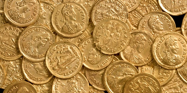 Oct. 17, 2012: In this undated photo released by St Albans City and District Council, late Roman gold coins, examples of the solidus, a high-value coin struck in the late fourth century, are photographed before going on display at the Verulamium Museum, St Albans, England. A curator at the museum says the coins, found on private land north of St. Albans, would have been used for major transactions such as buying land or ship cargoes.