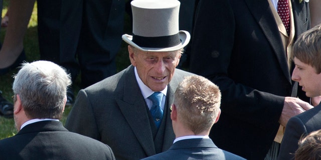 June 6, 2013: Prince Philip, center, the husband of Britain's Queen Elizabeth II attends a garden party at Buckingham Palace in London. Buckingham Palace says Queen Elizabeth II's husband was later admitted to a London hospital for an exploratory operation. The palace said the operation on 91-year-old Prince Philip will come after "abdominal investigations," but did not elaborate. (
