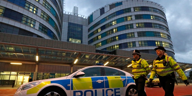 A surgeon who worked at Queen Elizabeth Hospital, seen above in 2012, admitted to etching his initials into two patients' livers during operations.