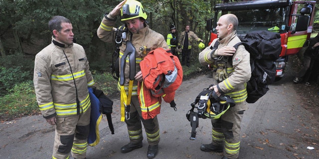 Sept. 16: Rescue workers arrive at the Gleision Colliery near Swansea, south Wales as a body is located in the flooded mine. British rescue workers found one miner dead after searching a flooded coal mine in south Wales, but pressed on Friday with the search for three others trapped underground.