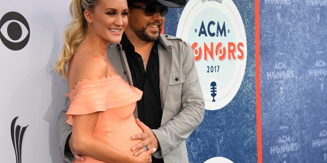 Jason Aldean and his wife Brittany arrive at the 11th Annual ACM Honors in Nashville, Tennessee.