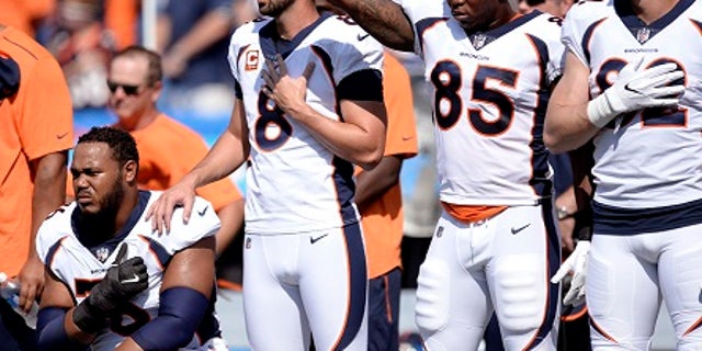 About half of the Denver Broncos roster knelt or sat during the national anthem before the game.