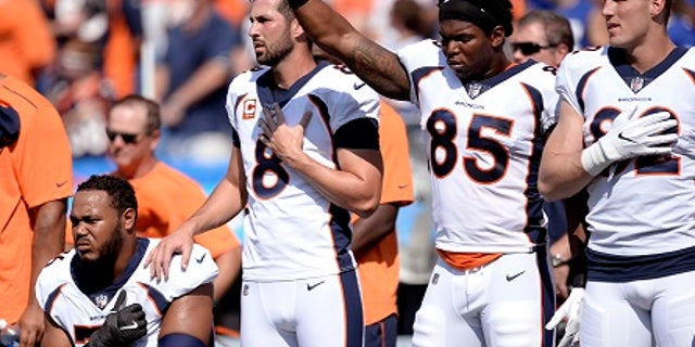 About half of the Denver Broncos roster knelt or sat during the national anthem before the game.