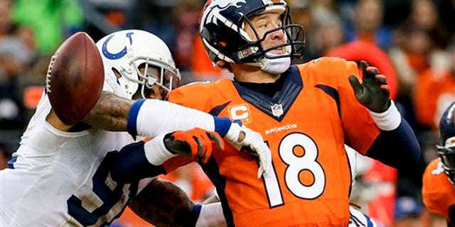 Jan. 11, 2015: Indianapolis Colts linebacker Jonathan Newsome, left, reaches in to force Denver Broncos quarterback Peyton Manning fumble during the first half of an NFL divisional playoff football game.