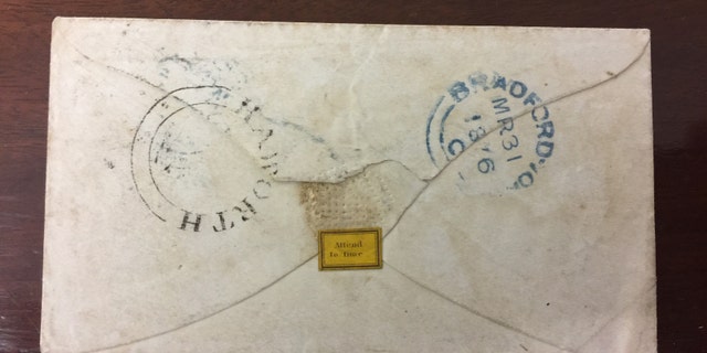 The reverse of the envelope addressed to Bronte's friend Ellen Nussey postmarked 1846 (Henry Aldridge & Son).