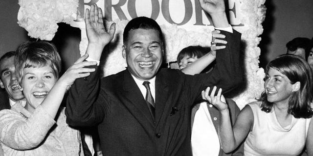 Sept. 14, 1966: This file photo shows Edward W. Brooke joining campaign workers in celebration, in Boston, after winning the Republican nomination for U.S. Senate. (AP)