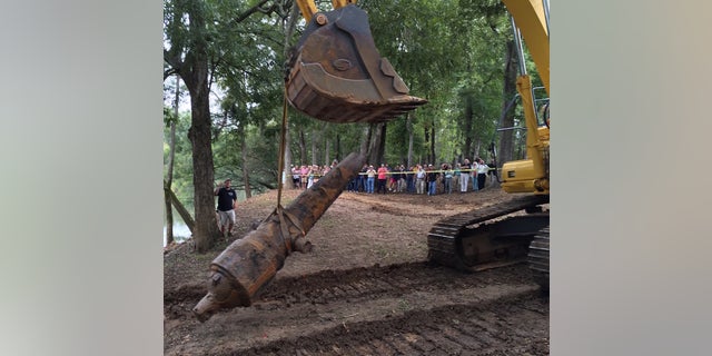 A giant frontend loader was used to pull the heavy cannons from the riverbed.