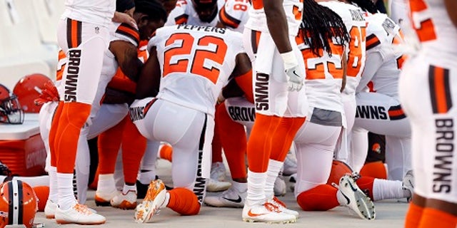 New York Giants football team during a moment of prayer for