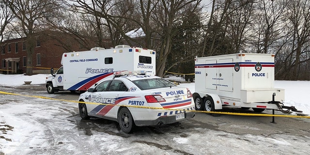 Feb. 3, 2018: Police vehicles are parked outside a property connected to alleged serial killer Bruce McArthur where they say they have recovered the remains of at least seven people from planters.