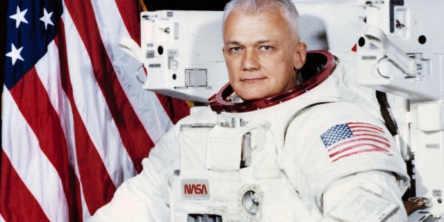 File 1982: Astronaut Bruce McCandless wears a shuttle Extravehicular Activity (EVA) Suit with Manned Maneuvering Unit (MMU) in Houston. The NASA Johnson Space Center says he died Thursday.