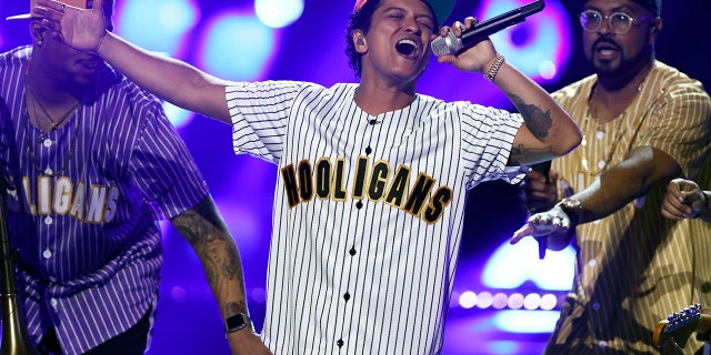 Bruno Mars, seen in this file photo on June 25, 2017, was forced to temporarily stop his concert in Glasgow, Scotland on Tuesday after a firework caused a small fire.