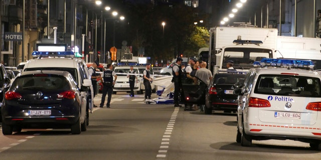 Police secure the scene in downtown Brussels after an attack on Belgian Army soldiers Friday night.