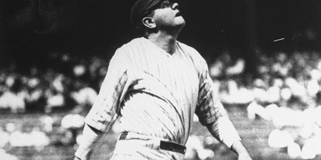 FILE 1927: Babe Ruth lofts another home run into the right field upper deck at Yankee Stadium in New York on the way to his 60-home run year.
