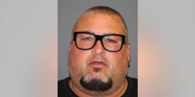 Bryan Abrams, 48, was arrested on Sunday for allegedly pushing his bandmate onstage during a performance in New York.