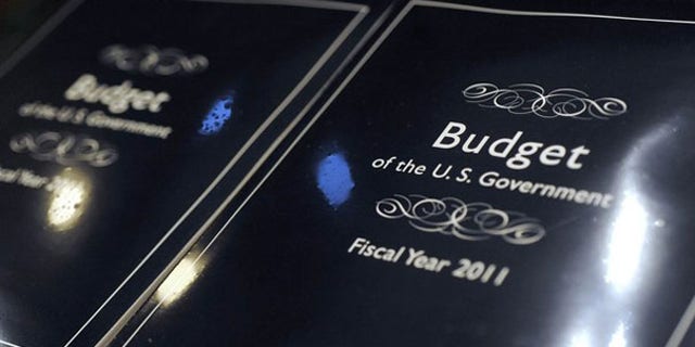 The cover of President Obama's 2011 budget is seen as copies are unpacked for distribution to Senate staff on Capitol Hill Feb. 1.