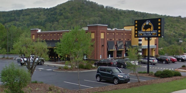 Justice was apprehended after officers responded to reports of a naked man lying on the sidewalk outside Buffalo Wild Wings.