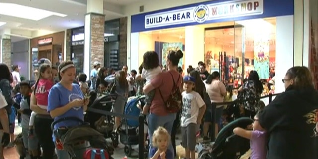 Parents on Thursday waited in line with their children for hours to get their hands on a discounted stuffed toy. (KGO via NNS)