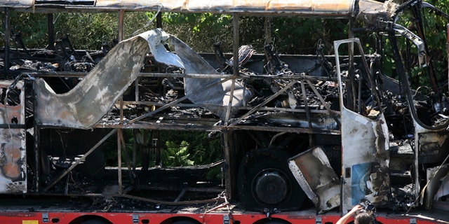 July 19, 2012: In this file photo, a damaged bus is transported out of Burgas airport, Bulgaria, a day after a deadly suicide attack on a bus full of Israeli vacationers.
