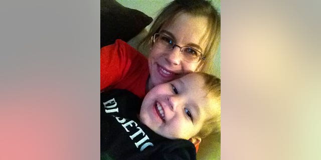 Nov. 9, 2013: Stephanie Metz poses for a photo with her 2-year-old son Jameson in Rapid City, S.D.