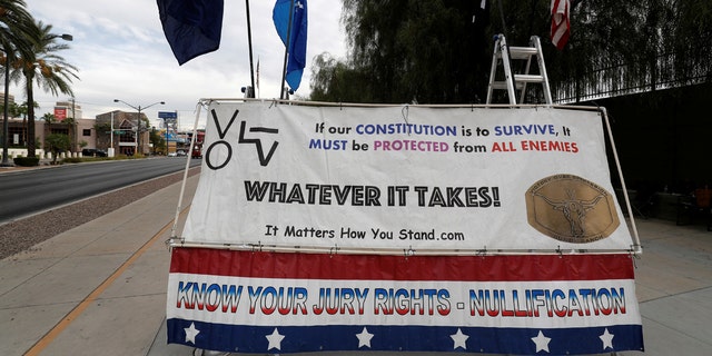 A sign is shown outside the federal courthouse during the trial for Nevada rancher Cliven Bundy in Las Vegas, Oct. 30, 2017.