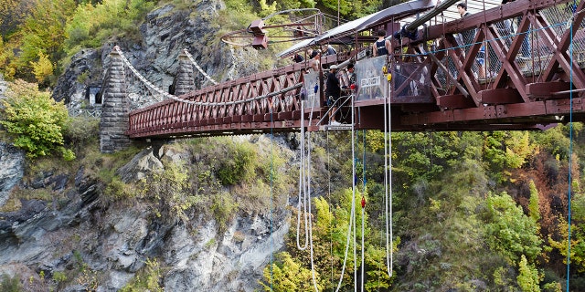 A father is receiving backlash for letting his young daughter bungee jump with him.