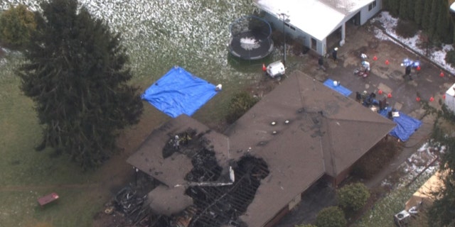 The burned home of the Kroeker family in Hubbard, Oregon.