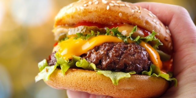 burger in hand istock medium