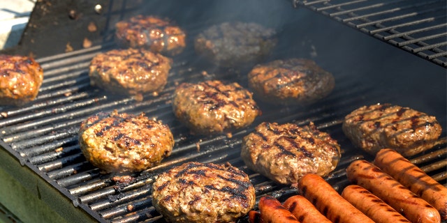 Burgers and hot dogs on the grill.