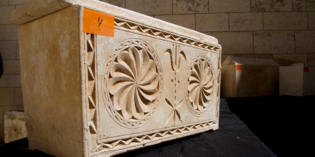 March 31, 2014: A 2,000 year-old Jewish burial box is on display in Jerusalem.
