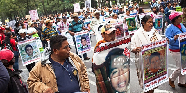 Family of 43 missing students from Ayotzinapa Normal school in the state of Guerrero lead a protest, September 26, 2015 in Mexico City, Mexico. (Photo by Brett Gundlock/Getty Images)