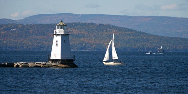 FILE-In this Oct. 10, 2008, file photo, boats travel across the waters of Lake Champlain in Burlington, Vt. Mountain and lake views along with fall foliage can be had for free in Vermont's largest city of Burlington, which feels more like a big town than a city. (AP Photo/Toby Talbot)