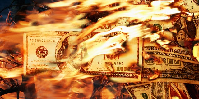 One Hundred Dollar Bills in fire