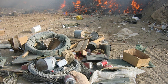 Burn pits, like this one at FOB Marez, were originally considered a temporary measure to get rid of huge amounts of waste generated at bases. The array of material sent to the pits is said to have included plastics, batteries, metals, appliances, medicine, dead animals and even human waste.