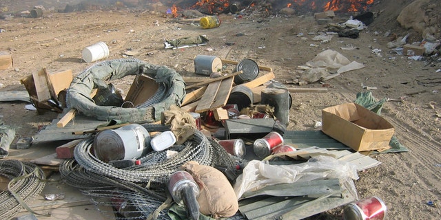 Burn pits, like this one at FOB Marez, were originally considered a temporary measure to get rid of huge amounts of waste generated at bases. The array of material sent to the pits is said to have included plastics, batteries, metals, appliances, medicine, dead animals and even human waste.