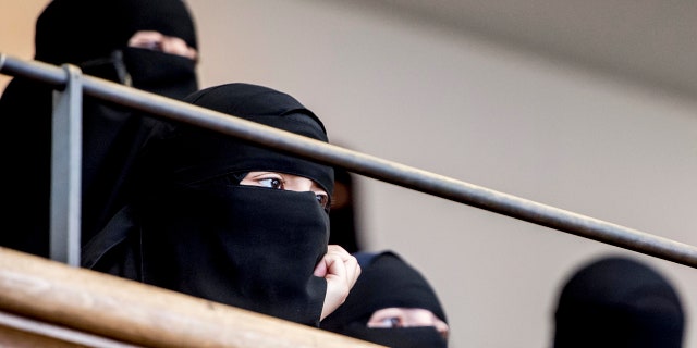 Women wearing the islamic veil niqab sit in the audience seats of the Danish Parliament, at Christiansborg Castle, in Copenhagen, Denmark, Thursday May 31. 2018. Denmark joined some other European countries in deciding Thursday to ban garments that cover the face, including Islamic veils such as the niqab or burqa. (Mads Claus Rasmussen/Ritzau Scanpix via AP)