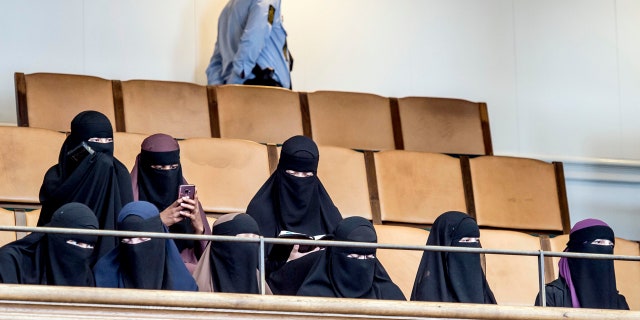 Women wearing the islamic veil niqab sit in the audience seats of the Danish Parliament, at Christiansborg Castle, in Copenhagen, Denmark, Thursday May 31. 2018.