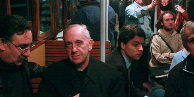 In this 2008 photo, Argentina's Cardinal Jorge Mario Bergoglio, second from left, travels on the subway in Buenos Aires, Argentina. Bergoglio, named pope on Wednesday, March 13, 2013, was known for taking the subway and mingling with the poor of Buenos Aires while archbishop. Bergoglio chose the name Pope Francis and is the first pope ever from the Americas. (AP Photo/Pablo Leguizamon)
