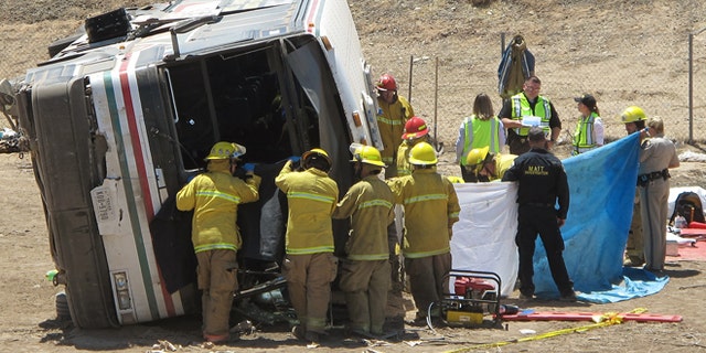 May 21: Emergency personnel respond to the scene of a fatal accident in Blythe, Calif. A tractor-trailer spilled a load of steel pipes onto a highway, triggering a bus crash Wednesday that killed four people and seriously injured several others on the main road linking Southern California and Arizona, authorities said.