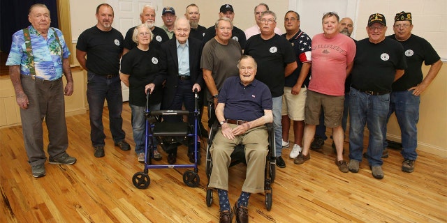 Bush seen posing with attendees of a monthly pancake breakfast at the American Legion Post 159 in Kennebunkport, Maine on Saturday.