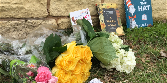 Children's books were placed outside of the Bush library and museum in honor of Barbara Bush, along with flowers and notes.