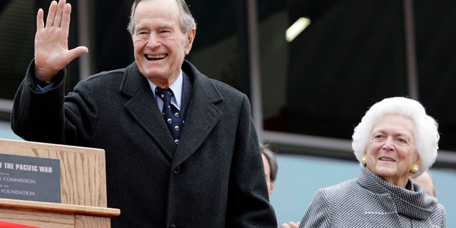 FILE - In this Dec. 7, 2009 file photo, former President George H.W. Bush and former first lady Barbara Bush arrive for a ceremony to dedicate an expanded gallery that carries his name at the National Museum of the Pacific War, in Fredericksburg, Texas. (AP Photo/Eric Gay, File)