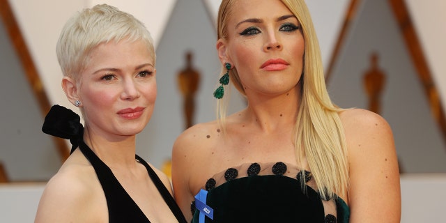 Michelle Williams (left) and Busy Philipps attend the 89th Academy Awards.