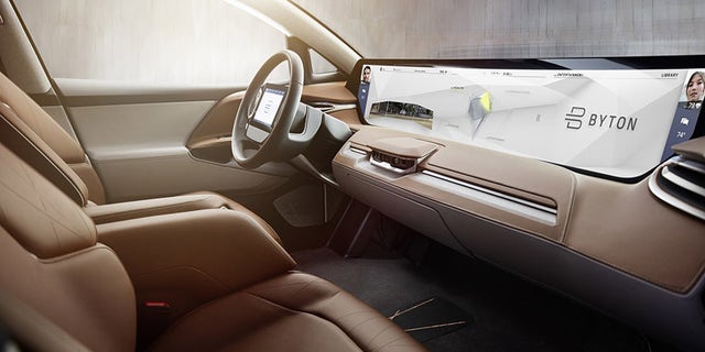 The $45,000 car has a range of 250 miles and a wall-to-wall touchscreen infotainment system.