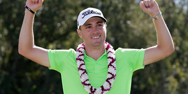Justin Thomas celebrates after the final round of the Tournament of Champions golf event, Sunday, Jan. 8, 2017, at Kapalua Plantation Course in Kapalua, Hawaii. (AP Photo/Matt York)
