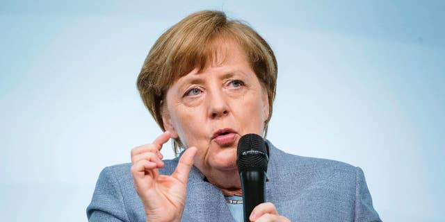German Chancellor Angela Merkel speaks at the W20 Summit in Berlin, Germany, Wednesday, April 26, 2017. The conference aims at building support for investment in women's economic empowerment programs. (Gregor Fischer/dpa via AP)