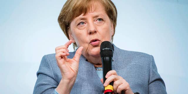 German Chancellor Angela Merkel speaks at the W20 Summit in Berlin, Germany, Wednesday, April 26, 2017. The conference aims at building support for investment in women's economic empowerment programs. (Gregor Fischer/dpa via AP)