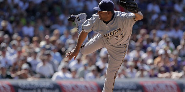DENVER, CO - JULY 17: Relief pitcher Francisco Rodriguez #57 of the Milwaukee Brewers delivers against the Colorado Rockies at Coors Field on July 17, 2011 in Denver, Colorado. Rodriguez earned a hold as they Brewers defeated the Rockies 4-3. (Photo by Doug Pensinger/Getty Images)