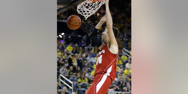 Wisconsin forward Frank Kaminsky (44) dunks during the second half of an NCAA college basketball game against Michigan in Ann Arbor, Mich., Sunday, Feb. 16, 2014. Kaminsky finished with 25 points in the Badgers 75-62 win. (AP Photo/Carlos Osorio)