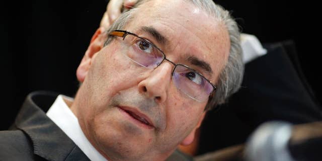 FILE - In this Aug.21, 2015 file photo, Eduardo Cunha, president of Brazil's Chamber of Deputies, attends a meeting with union workers in Sao Paulo, Brazil. Brazil's Supreme Court seized $2.45 million in Swiss accounts allegedly belonging to Cunha, a powerful political figure who can largely determine whether widely sought impeachment proceedings against President Dilma Rousseff are introduced on the chamber floor. Cunha is facing corruption charges in a huge kickback scheme at state-run oil company Petrobras. (AP Photo/Andre Penner, File)