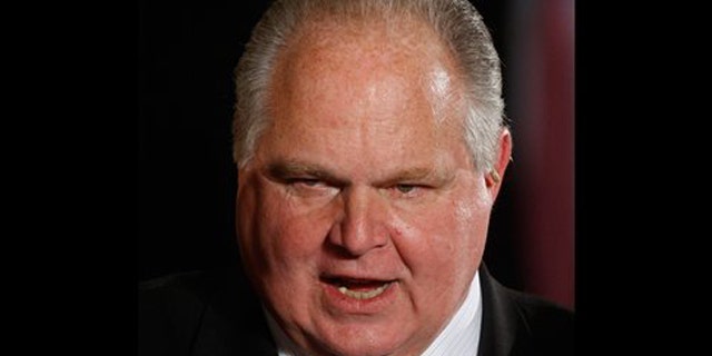 Jan. 13, 2009: In this file photo, conservative talk show host Rush Limbaugh talks with guests in the East Room of the White House in Washington.